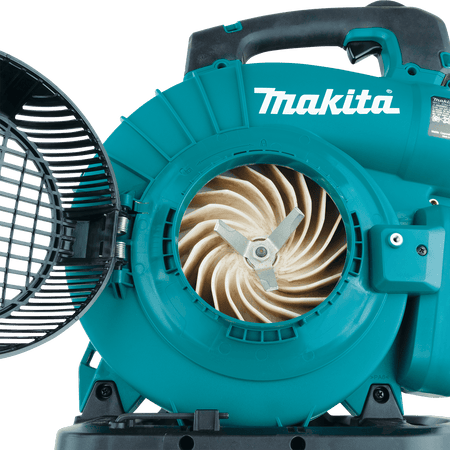 Internal view of the Makita mulcher impeller and shredder blade housing with the access door open.