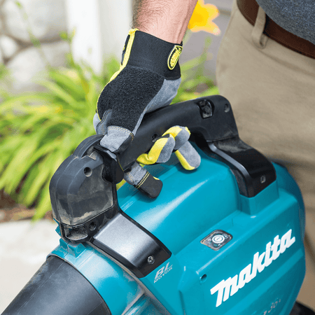 Close-up of rubberized soft-grip handle and cruise control lever on the Makita XBU04PTV blower.