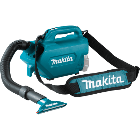 Makita XLC07Z 18V cordless canister vacuum equipped with a padded shoulder strap and wide seat nozzle for mobile interior vehicle detailing.