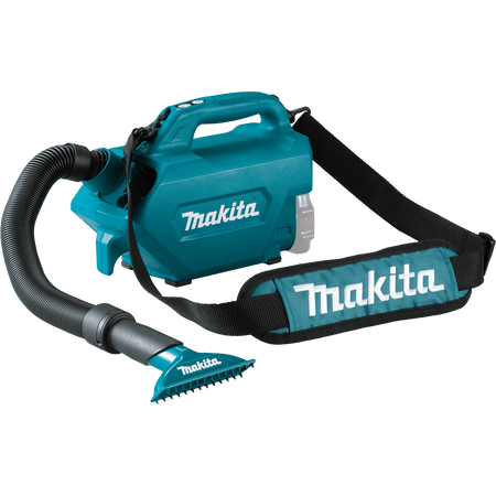 Makita XLC07Z canister vacuum shown with the wide floor mat nozzle and padded shoulder strap installed for portable mobile cleaning.