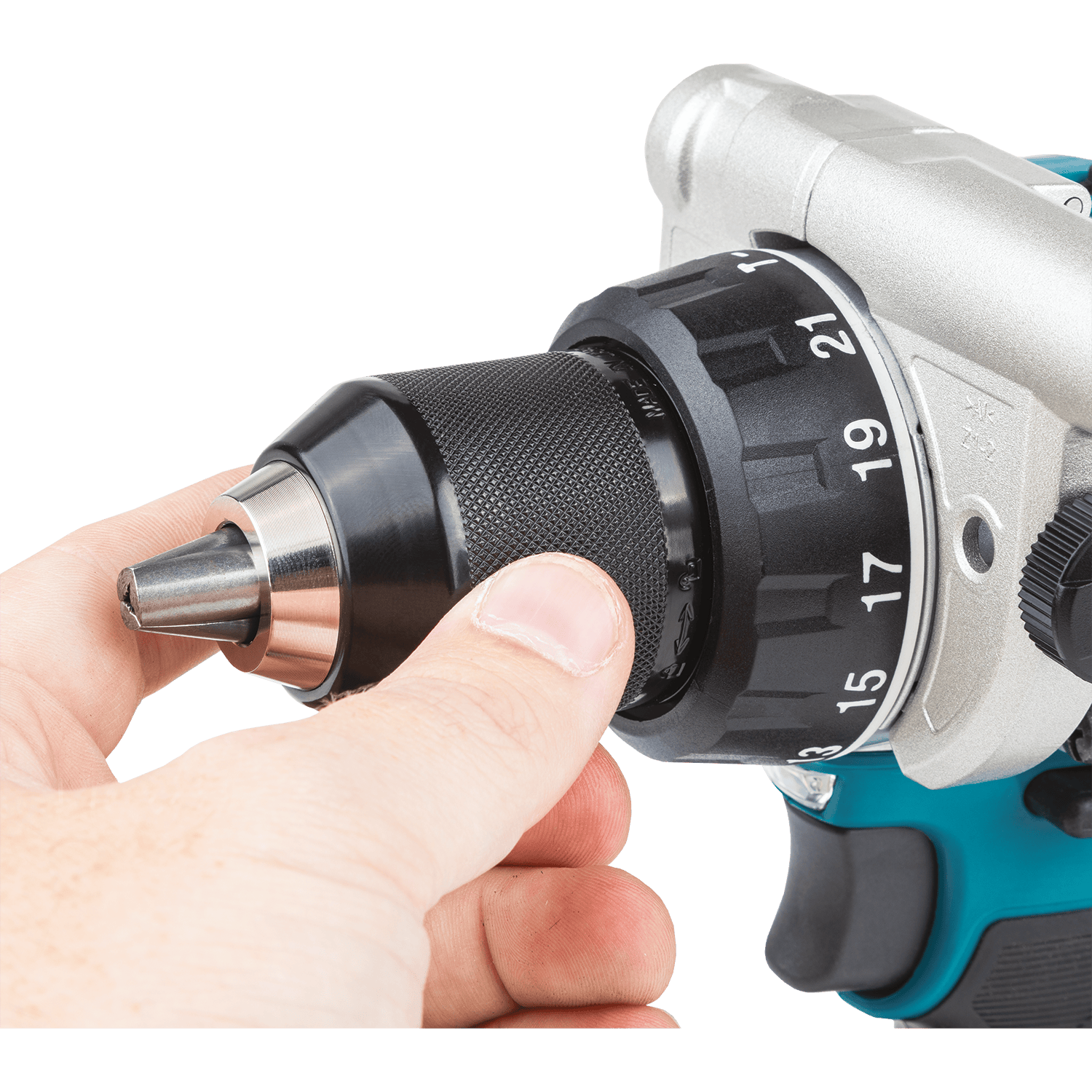 Hand tightening the all-metal 1/2-inch keyless ratcheting chuck on the Makita XPH14 hammer drill for maximum bit retention during heavy drilling.