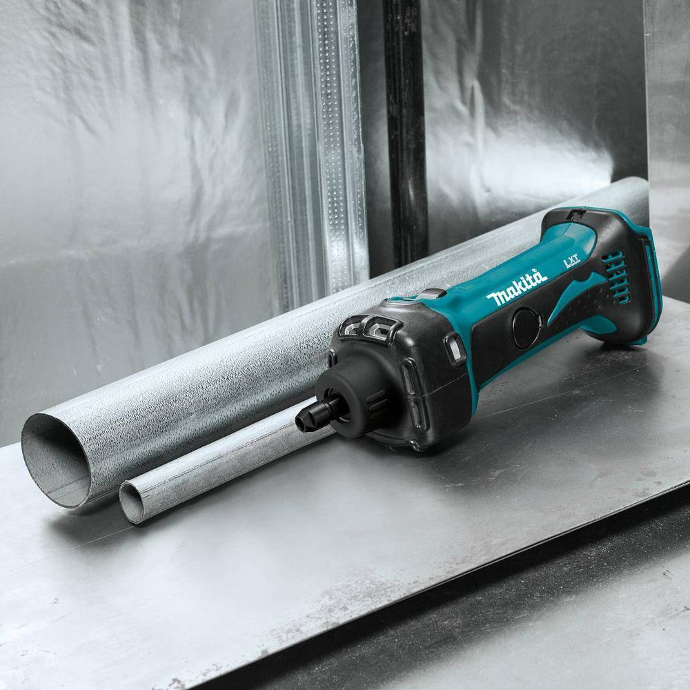 Makita XDG02Z cordless die grinder resting on a steel fabrication workbench alongside metal tubing for internal deburring jobs.