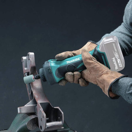 Fabricator using the 18V LXT Makita XDG02Z die grinder with a cylindrical grinding wheel to smooth rough cast iron casting edges.