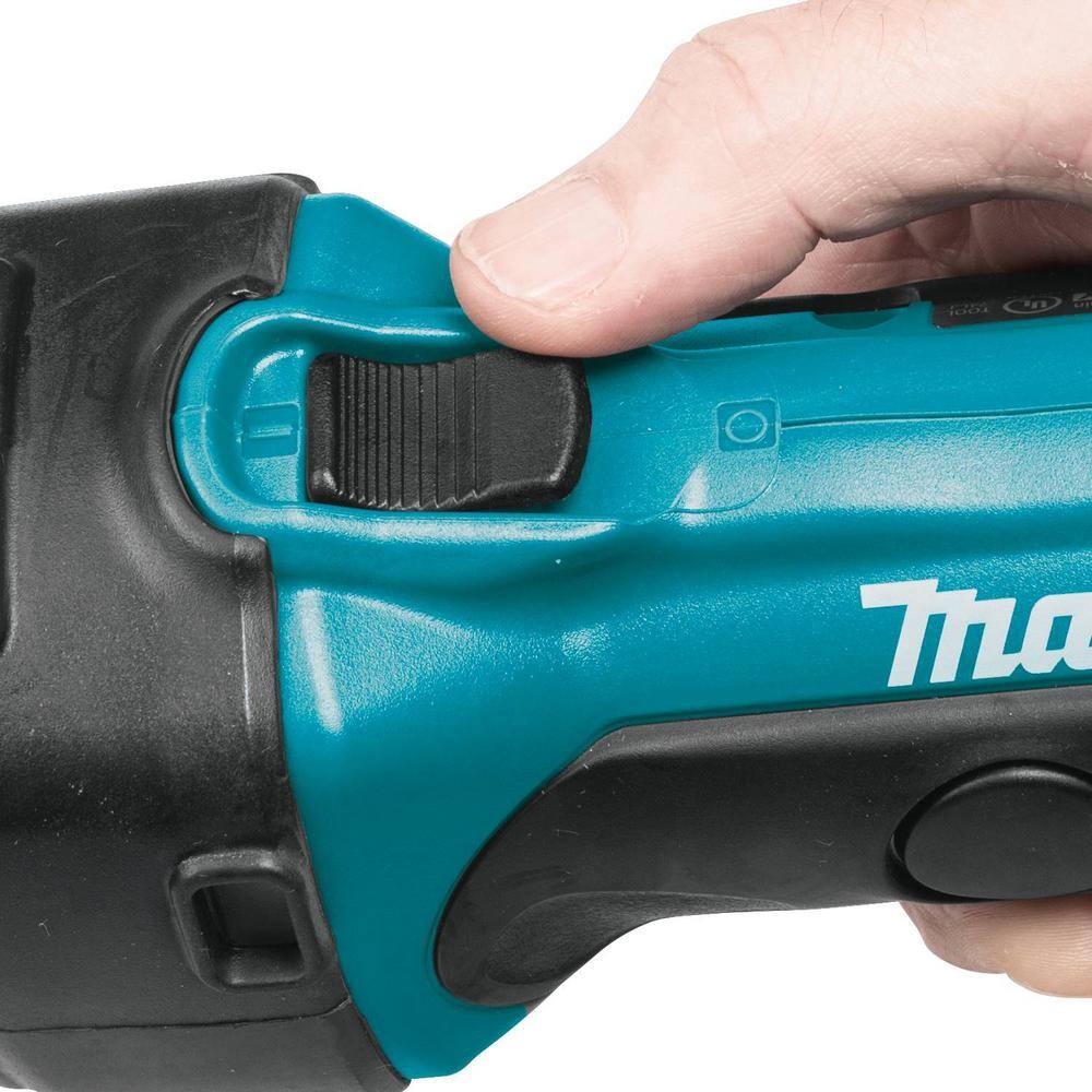 Operator sliding the top thumb switch with lock-on capability on the Makita XDG02Z die grinder for continuous metal grinding.