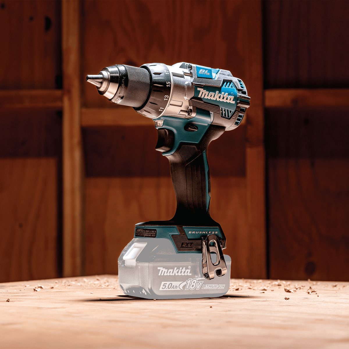 Studio view of the Makita XFD16Z 18V LXT brushless driver-drill bare tool resting on a jobsite workbench.