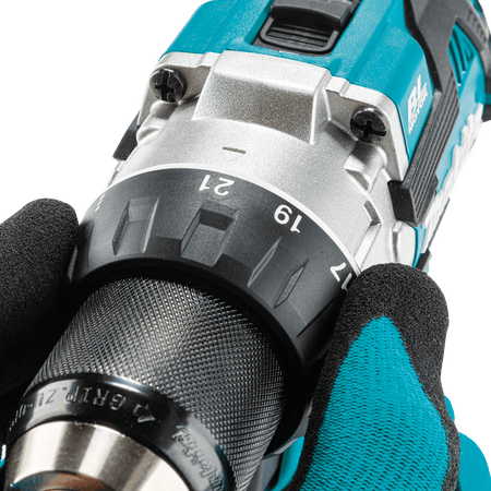 Gloved hand adjusting the 21-stage clutch torque collar on the Makita XFD16Z 1/2-inch driver-drill for precise fastener depth.