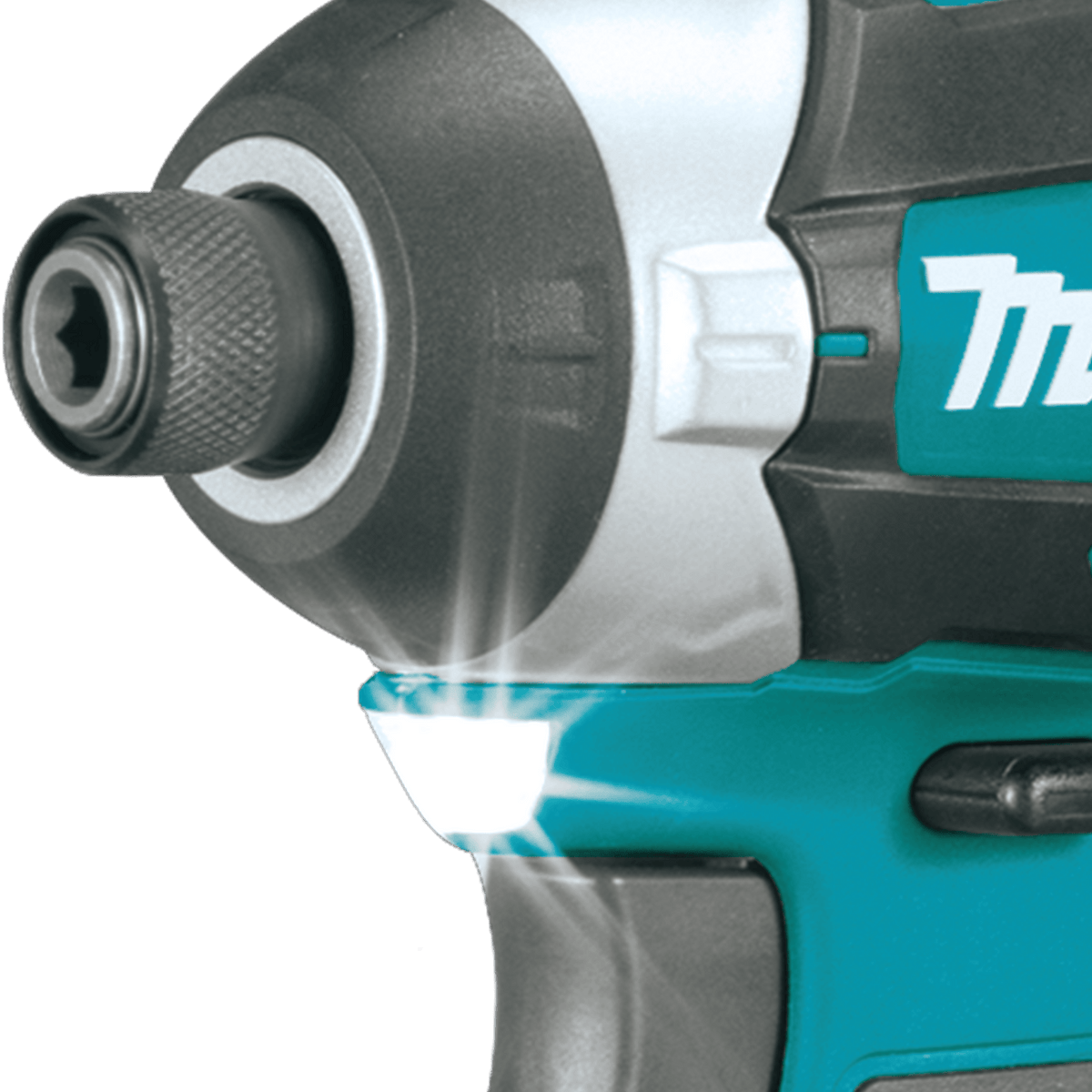 Integrated LED work light below the 1/4-inch hex chuck on the Makita impact driver illuminates dark work areas.