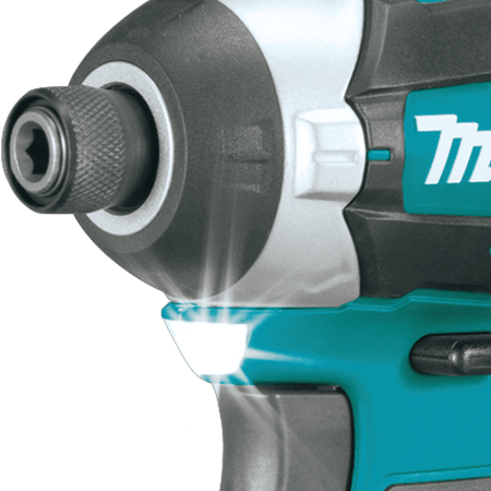 Integrated LED work light below the 1/4-inch hex chuck on the Makita impact driver illuminates dark work areas.