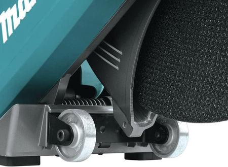 Macro close-up structural detail of the integrated dual all-aluminum roller wheels positioned under the motor carriage frame of the Makita masonry power cutter to maintain tracking alignment during concrete floor cutting.