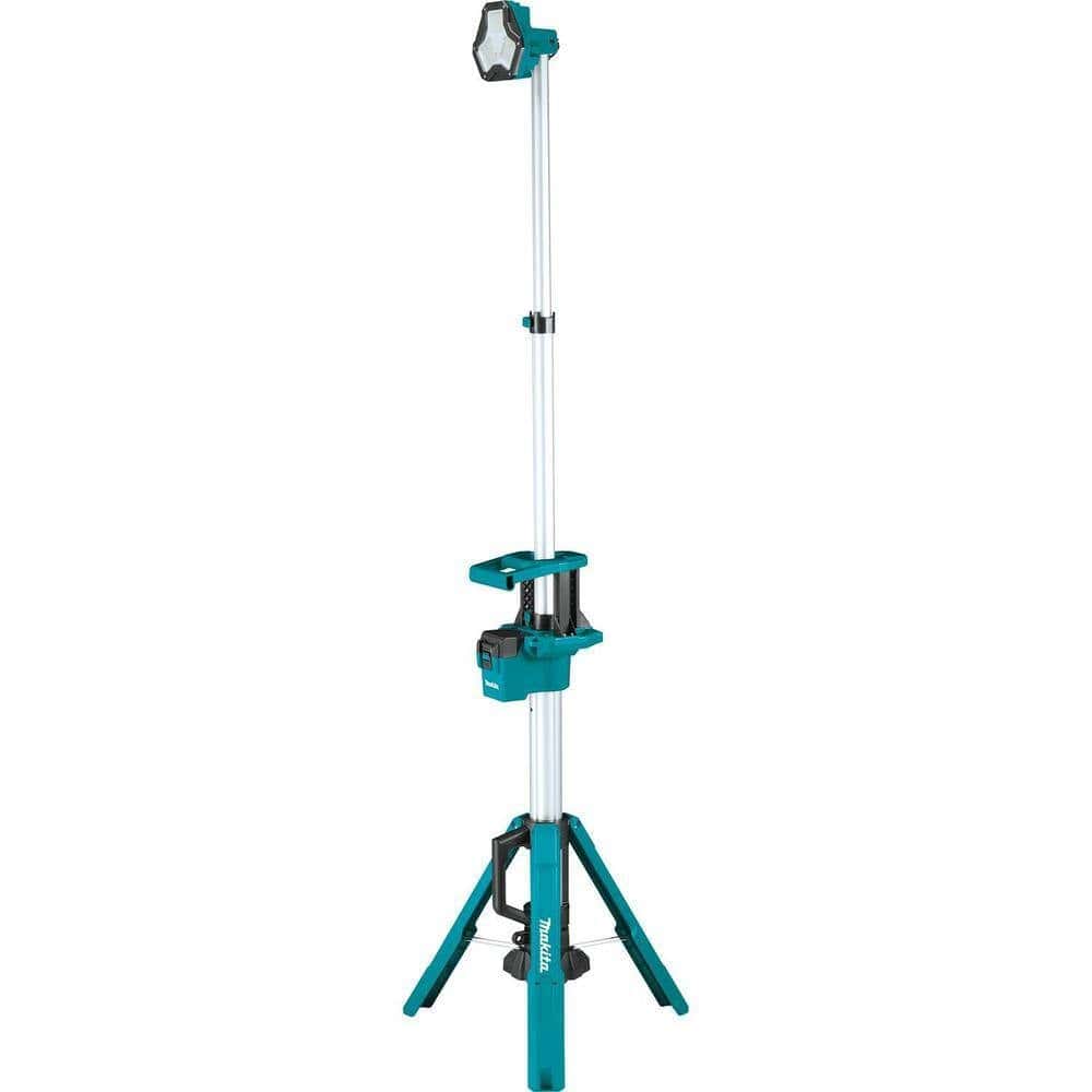 A fully extended Makita DML813 18V LXT cordless tower work light reaching its maximum height on a stable tripod base with a single LED lamp head pointing forward.
