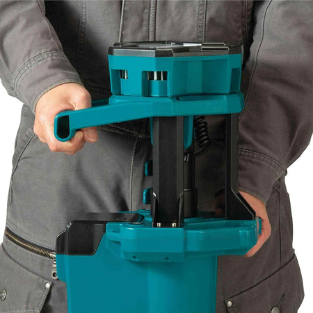 Close-up view of the Makita DML813 center assembly showing the robust carrying handle and the compact way the light head stows when the tripod is folded for storage.