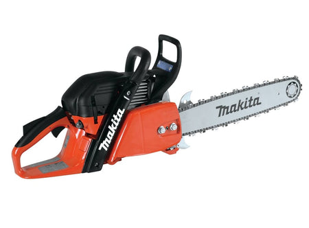 Studio side profile view of the Makita 20-inch professional gas chainsaw featuring an orange magnesium body and white guide bar.