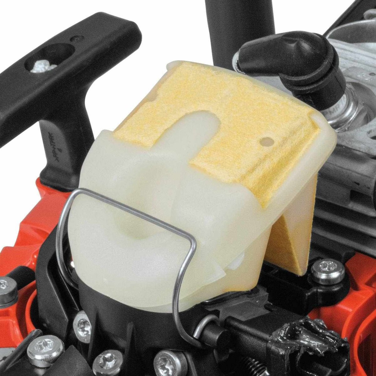 Close-up view of the heavy-duty air filter element housed within the upper casing of the chainsaw engine.