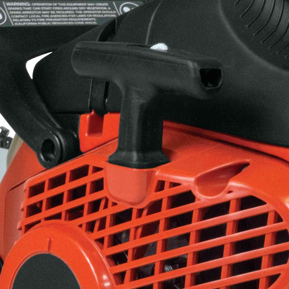 Close-up detail of the black Easy Start pull cord handle located on the side of the orange chainsaw housing.