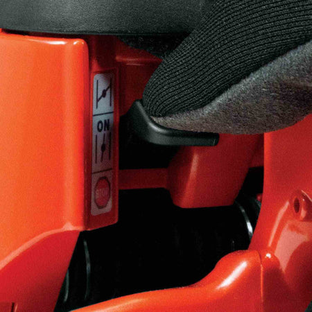 Close-up of the Touch and Stop single lever control switch used for engine choke, run, and shut-off functions.