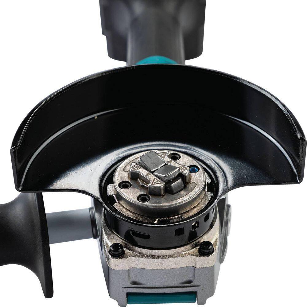 Detailed shot of the Makita X-LOCK interface with a grinding wheel installed, highlighting the secure click-mount system that eliminates the need for traditional locknuts and wrenches.