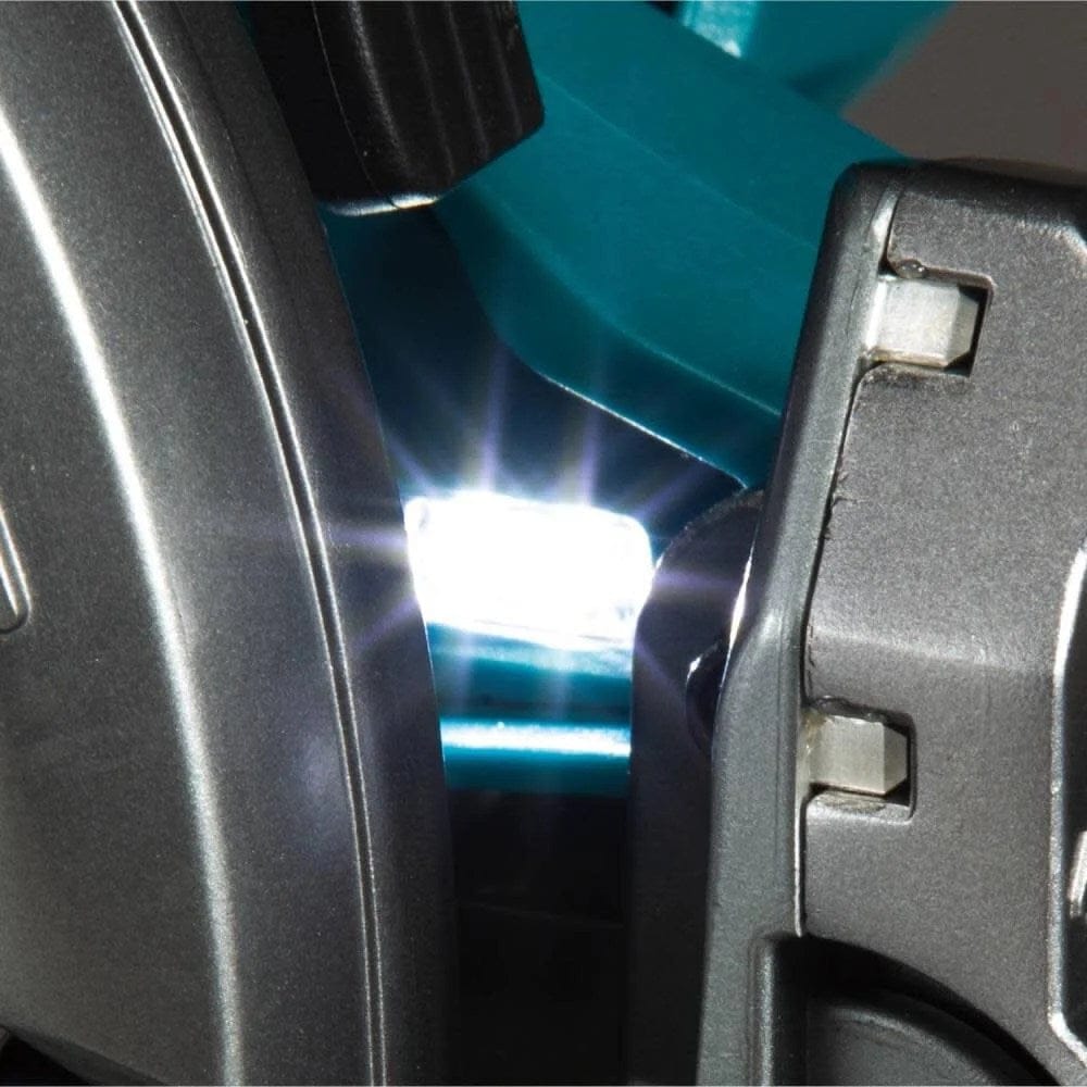Close-up detail view of the built-in LED light located near the blade housing illuminating the cutting area.