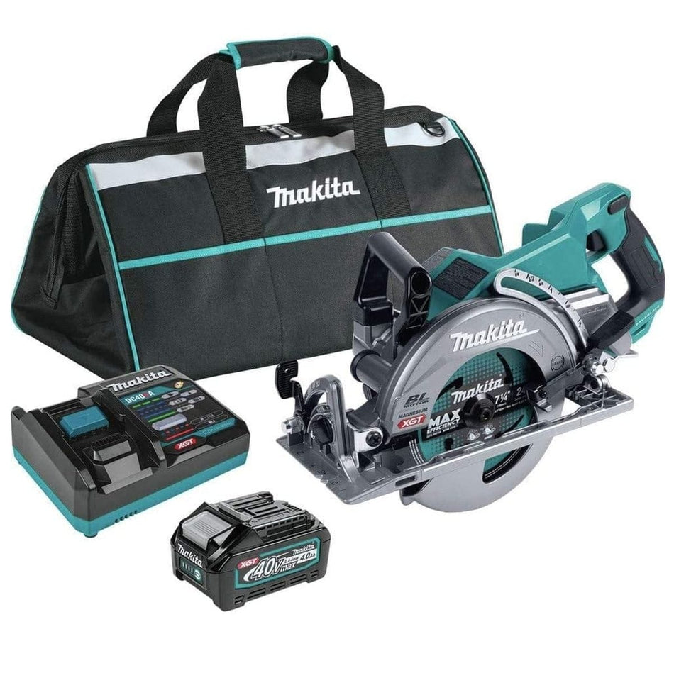 Studio view of the Makita GSR01M1 kit including the rear handle circular saw, a 40V max XGT battery, a rapid charger, and a black and teal contractor tool bag.