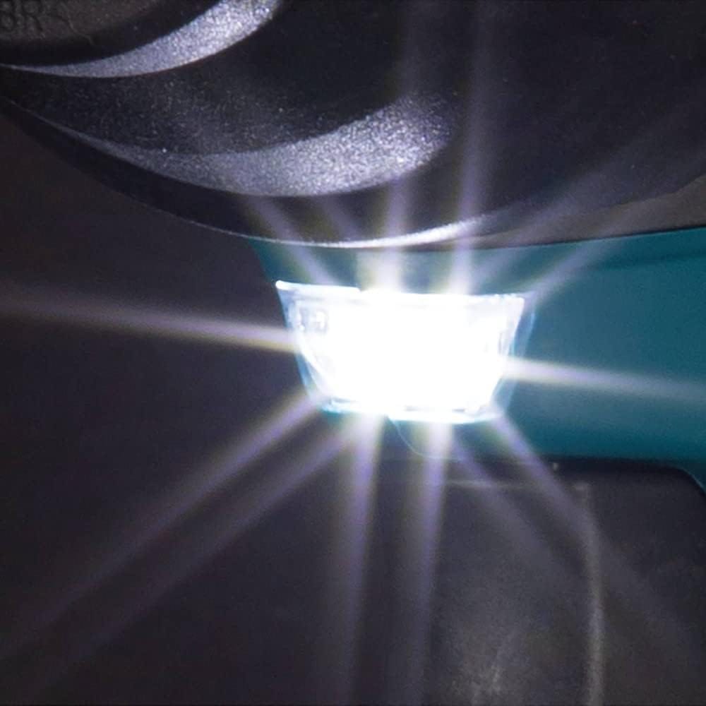 Macro close up shot of the built in bright LED work light activated on a Makita GWT08Z mid torque cordless impact wrench. The powerful light casting beams downward provides optimal visibility for automotive mechanics and fabricators working in dark or confined jobsites.