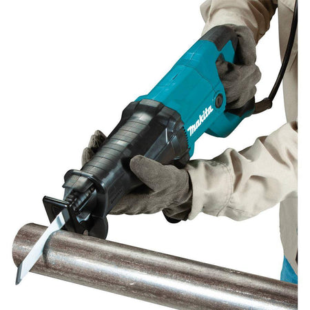 Technician utilizing the Makita corded reciprocating saw to slice through a metal pipe, showcasing the versatile cutting capability and precision provided by the variable speed trigger.