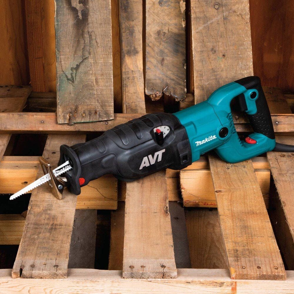 Isolated view of the Makita 15 AMP recipro pallet saw resting on a stack of industrial wooden pallets, showcasing its readiness for high-volume recycling and refurbishing tasks.
