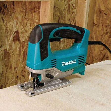 Front angled view of the Makita top handle power saw emphasizing the low-profile design and the tool-less blade change system for rapid, wrench-free T-shank blade installations.
