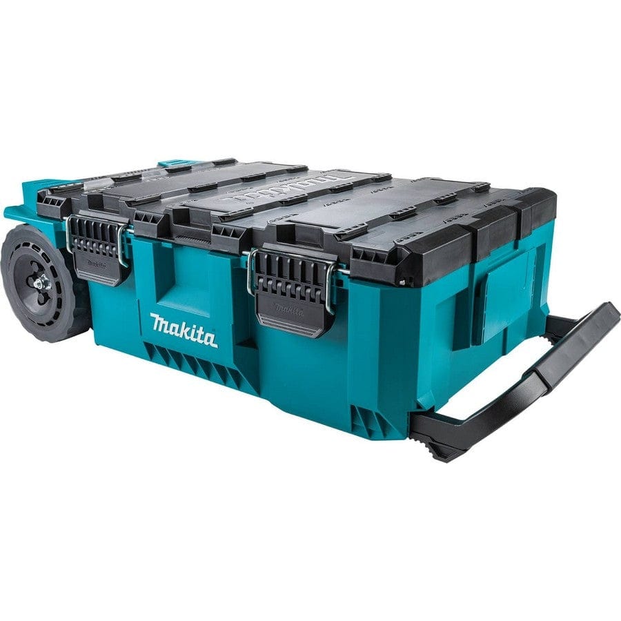 Makita-branded rolling tool chest with teal body, black lid, and large wheels. Features foldable pull handle, reinforced edges, and secure latches for rugged job site storage.