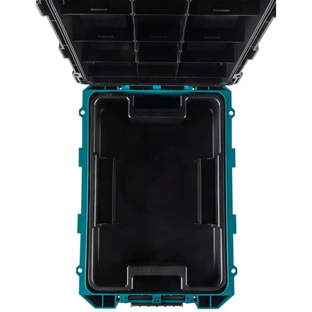A top-down view of the empty interior of the Makita T-90021 large tool box, showcasing the expansive 3,569 cubic inch holding capacity and the rugged reinforced construction.