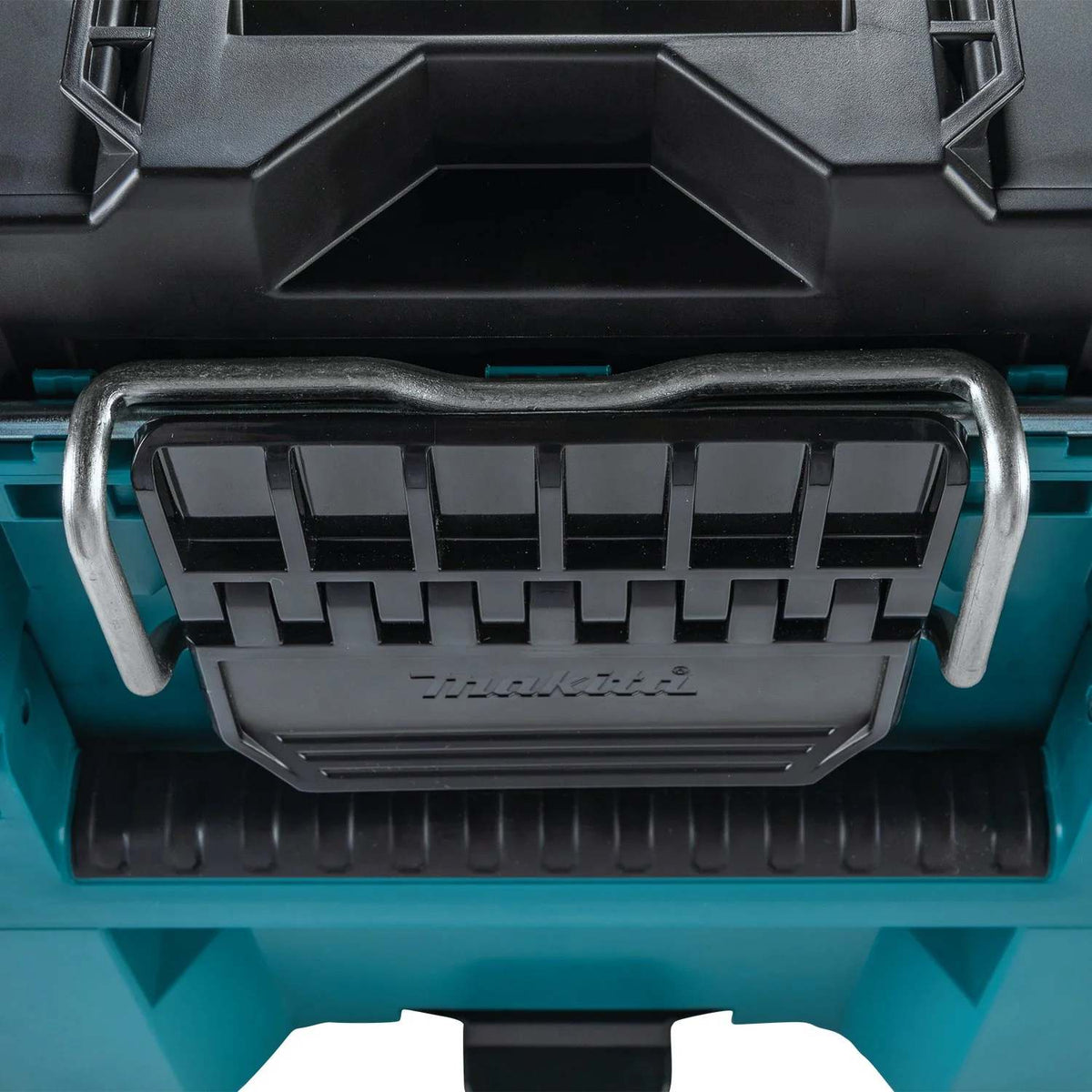 A detailed close-up shot of the heavy-duty metal-reinforced locking bar and large black latch on the Makita MAKTRAK large tool box, designed for maximum durability in tough jobsite conditions.