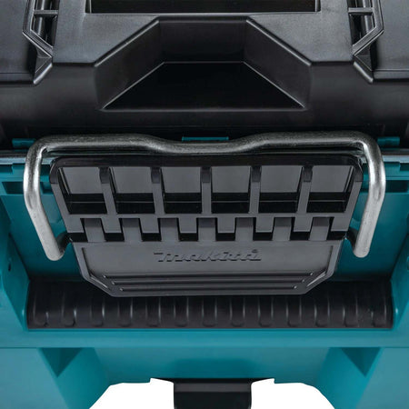 A detailed close-up shot of the heavy-duty metal-reinforced locking bar and large black latch on the Makita MAKTRAK large tool box, designed for maximum durability in tough jobsite conditions.