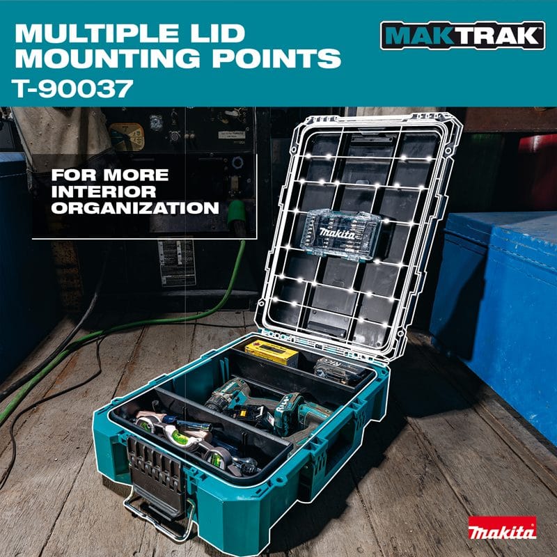 Application shot of the Makita T-90037 tool box on an industrial jobsite, showing the open lid with highlighted mounting points and the interior tray containing power tools and layout equipment.
