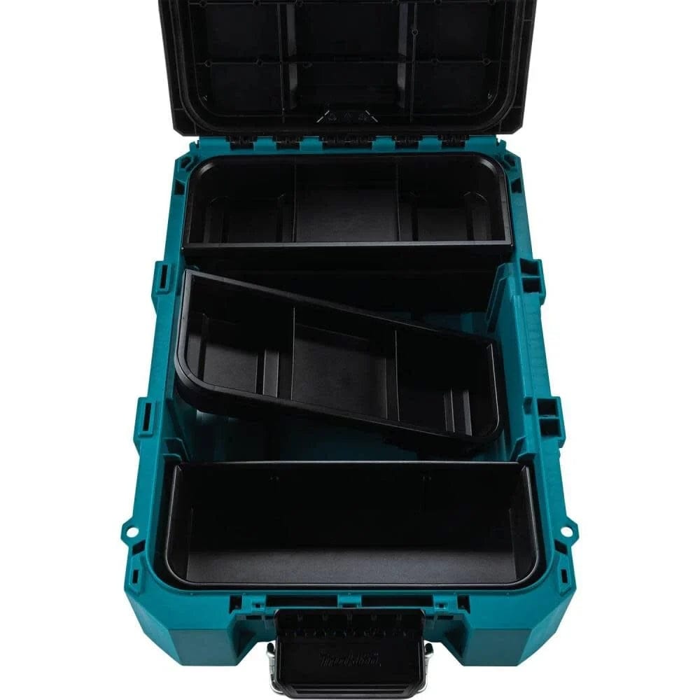 Interior view of the open Makita MAKTRAK T-90037 tool box displaying three removable black storage trays, including one deep tray and two shallow trays with multiple dividers for organized jobsite equipment.