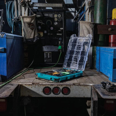 Wide-angle application shot of the open Makita MAKTRAK low-profile medium organizer on an industrial jobsite, demonstrating its use in a real-world professional environment.