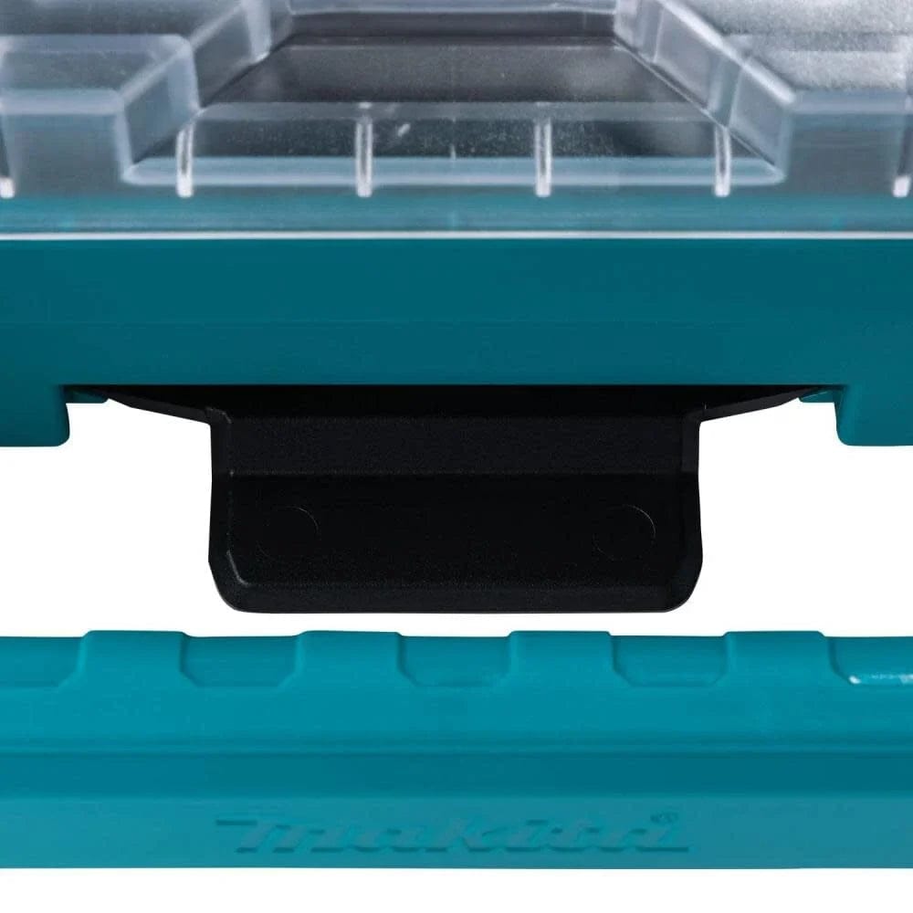 Close-up detail of the robust modular connection point and comfort-grip handle on the Makita MAKTRAK T-90059 organizer, designed for secure transportation and professional jobsite use.