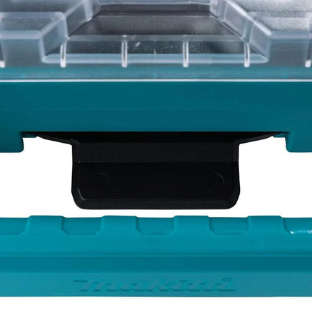 Close-up detail of the robust modular connection point and comfort-grip handle on the Makita MAKTRAK T-90059 organizer, designed for secure transportation and professional jobsite use.