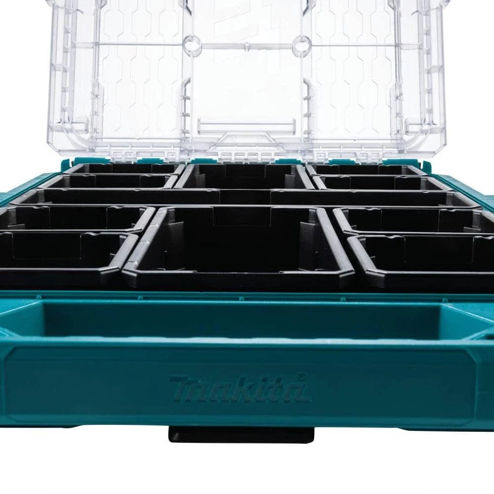 Interior view from a low angle showing the 11 removable black organizer bins inside the Makita MAKTRAK low-profile medium storage box, illustrating the efficient compartment layout.