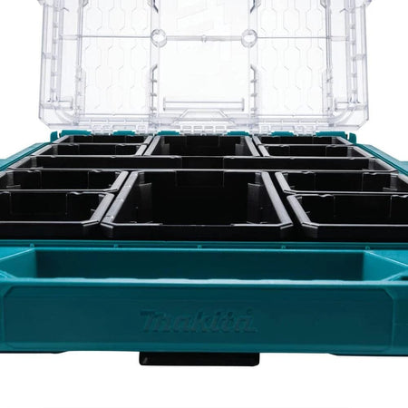 Interior view from a low angle showing the 11 removable black organizer bins inside the Makita MAKTRAK low-profile medium storage box, illustrating the efficient compartment layout.