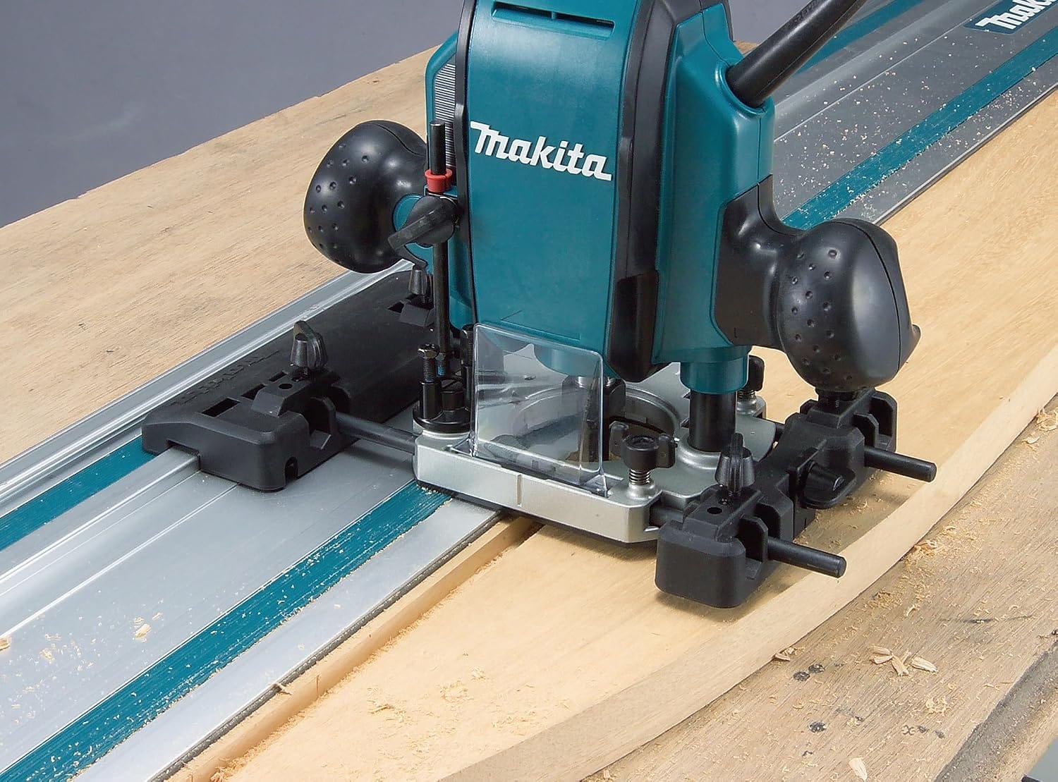 A Makita router attached to an optional guide rail adapter rides along the 194368-5 track for straight, splinter-free channel routing.