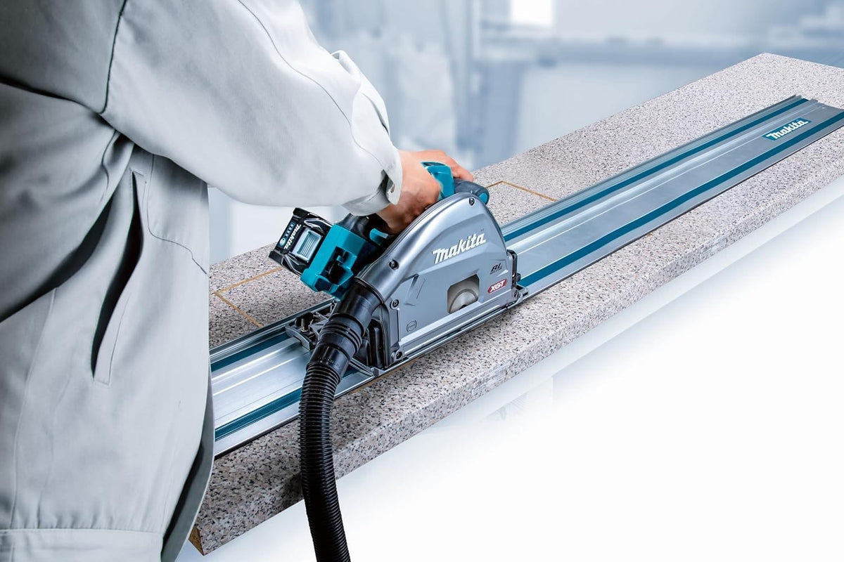 Cordless XGT plunge saw sliding on a 55-inch Makita track rail to perform precise, dust-controlled cuts in laminate countertops.