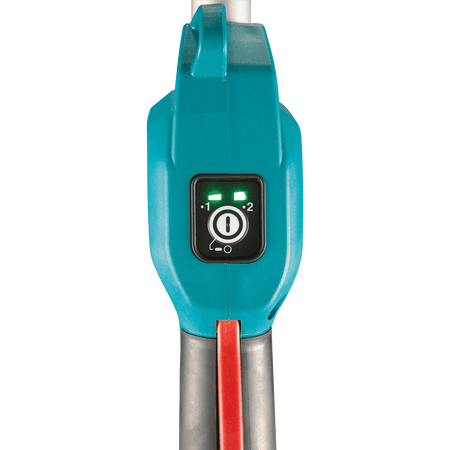 Electronic control panel on the Makita XUX02 power head displaying the power button and 2-speed level indicators for runtime management.