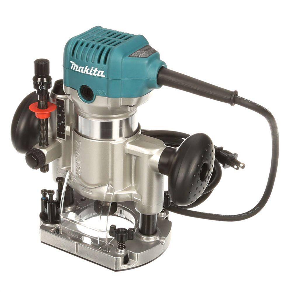 Makita 1-1/4 HP variable speed compact router motor installed in the plunge base attachment, highlighting the dual ergonomic handles and fine depth adjustment rod.