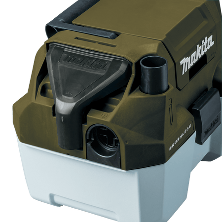 Onboard nozzle dock and flexible hose storage port on the Makita ADCV11Z wet dry vacuum for easy jobsite organization.