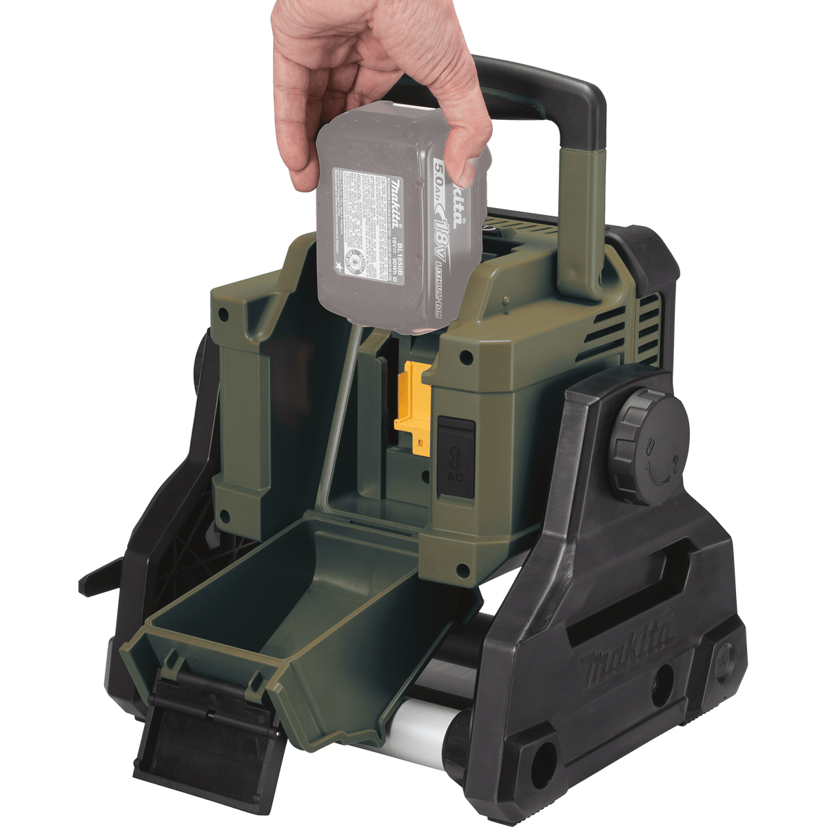 Hand inserting a 5.0Ah 18V LXT lithium-ion battery into the rear weather-sealed battery compartment of the Makita ADML811 area floodlight.