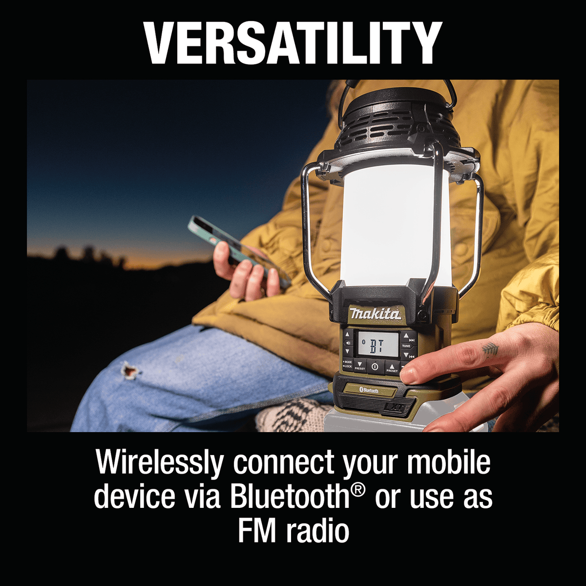 Person pairing a smartphone via Bluetooth to the Makita ADRM13 lantern while sitting outdoors at dusk.