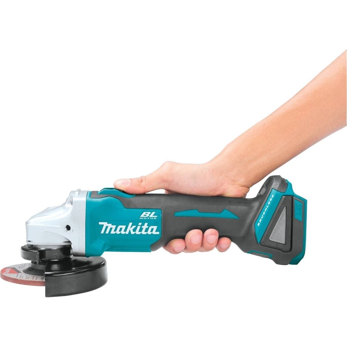 A hand holding the Makita cordless angle grinder by the barrel grip to demonstrate the ergonomic, slim body design.