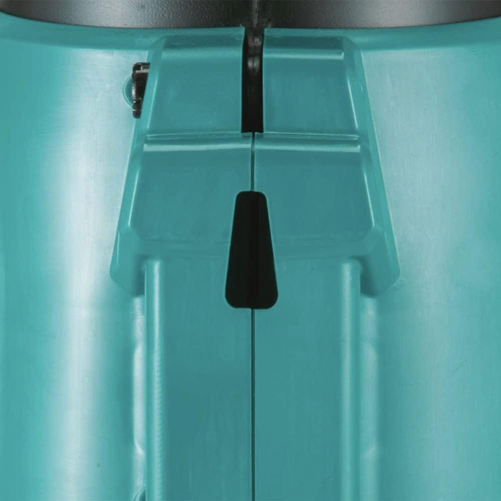 Close up view of the underbelly on the Makita teal plastic housing showcasing the integrated built in storage hang hole. This slot allows the handheld lawn cleaner power tool to hang completely flat against standard garage hooks or workshop pegboards for easy storage.