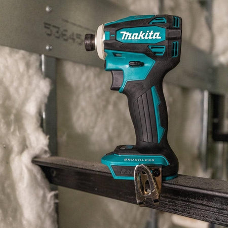 The Makita XDT19Z 18V LXT brushless impact driver shown in a jobsite environment, highlighting its rugged build quality and ergonomic grip for professional construction use.
