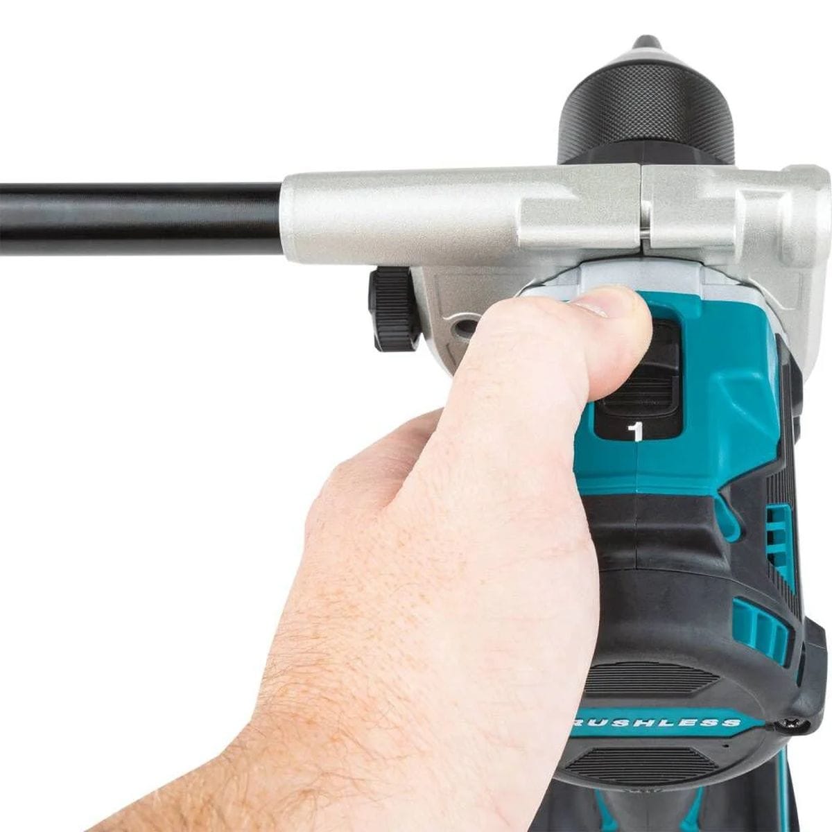 A close-up view of a hand operating the top-mounted 2-speed slide switch on the Makita 18V brushless hammer drill, illustrating the tactile control for shifting between high-speed and high-torque modes.