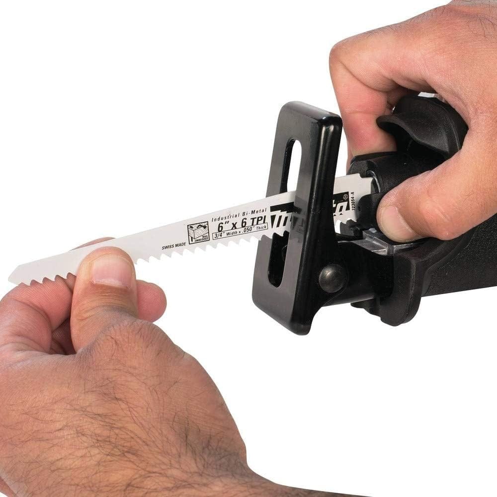 Close-up of hands inserting a white 6-inch blade into the tool-less blade change mechanism of the saw.