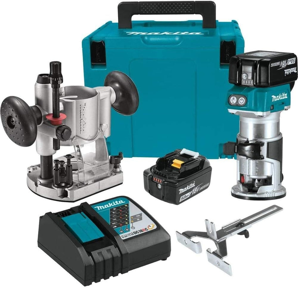 Studio view of the Makita XTR01T7 router kit including the router, plunge base, two batteries, charger, edge guide, wrenches, and teal system case.